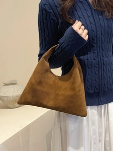 Retro brown suede tote bag with minimalist trapezoid design for casual commute style