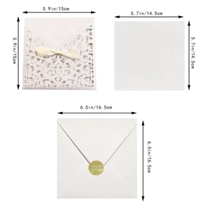 European ivory laser cut wedding invitation set with white ribbon and gold wax seal