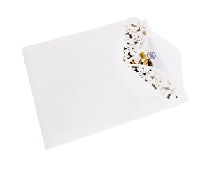 Detail of laser-cut cherry blossom edge on white invitation envelope and card