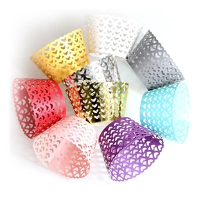 Detailed laser-cut heart pattern cupcake wrappers in multiple vibrant colors for baking decor