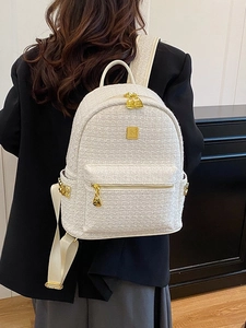 Minimalist cream white tweed backpack for women with gold zippers and metal logo