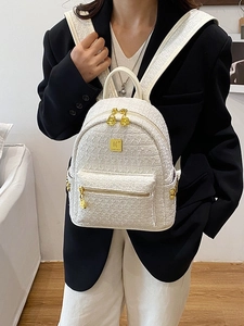White tweed mini backpack with gold hardware and woven texture for women's daily use