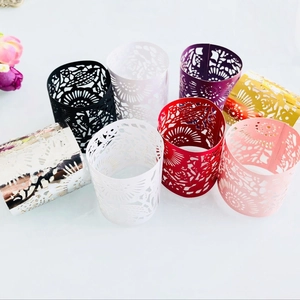 Intricate laser-cut hollow floral paper sleeves for LED candles in various elegant colors