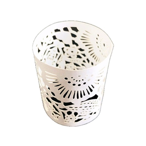 White laser-cut lace paper candle wraps with floral patterns for LED tea lights