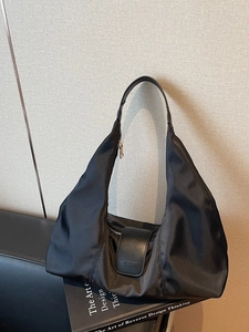 Minimalist black nylon hobo bag for women with large capacity and crescent moon shape