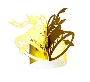 Close-up of golden Christmas bell napkin ring with bow design and mirror finish