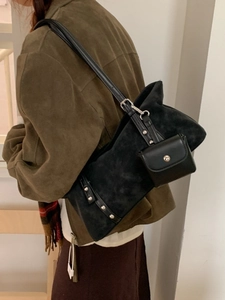 Minimalist black suede tote bag with leather strap and detachable coin purse accessory