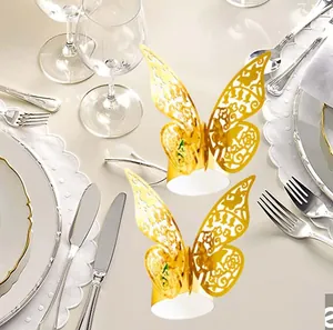 Detailed laser-cut golden butterfly napkin ring set on a refined dining table