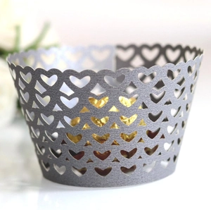Detail of laser-cut heart pattern on gray pearlescent paper cupcake wrapper
