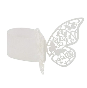 Macro detail of laser-cut butterfly paper napkin ring showing intricate hollowed floral patterns
