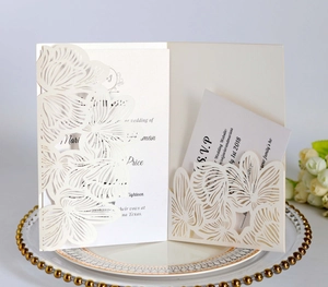 Detailed laser-cut hollow floral wedding invitation set with elegant RSVP card and inner page