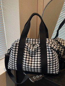 Large capacity black and white houndstooth travel bag with adjustable shoulder strap