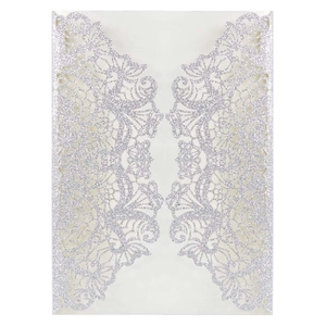 Detail view of laser-cut silver glitter invitation featuring elegant floral lace patterns