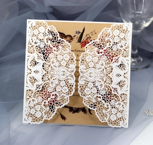 Laser cut lace wedding invitation with kraft paper insert and elegant floral patterns