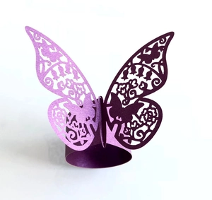 Exquisite laser-cut butterfly paper napkin rings in vibrant purple with floral hollow patterns