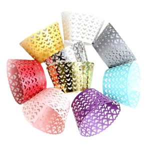 Laser cut hollow heart cupcake wrappers in assorted colors with metallic finish