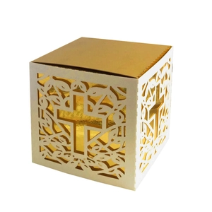 Detailed laser-cut hollow cross gift box with elegant gold interior and white exterior