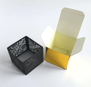 Detailed laser-cut floral pattern on a premium black and gold gift packaging box