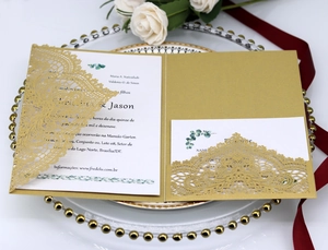 Elegant gold laser-cut lace wedding invitation set with floral white insert cards