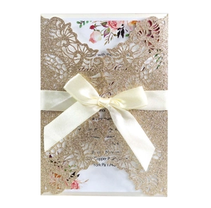 Champagne gold laser cut wedding invitation with satin bow and floral inner card