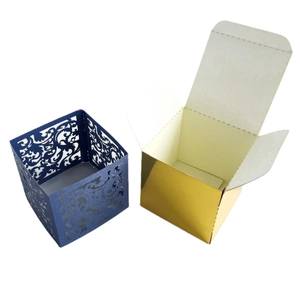 Laser cut hollow wedding favor box with blue vine patterns and gold inner lining