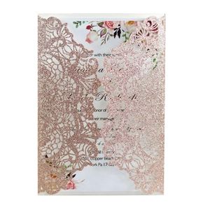 Detail of rose gold laser cut wedding invitation with glitter finish and floral inner card