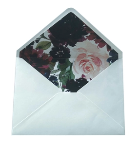 Elegant white wedding envelope with gold foil trim and vintage dark floral liner details