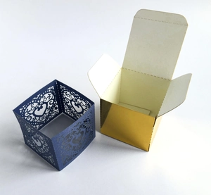 Laser cut heart pattern candy boxes in deep blue and gold mirror finish for weddings