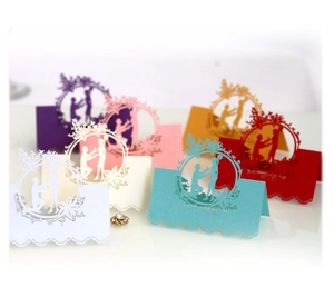 Elegant laser cut wedding table cards with hollow floral wreath and proposal silhouette
