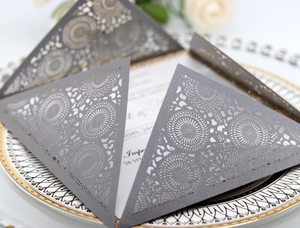 Elegant silver grey laser cut wedding invitation card with intricate mandala patterns