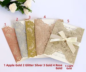 Laser cut floral wedding invitations in five glitter metallic colors with ribbon