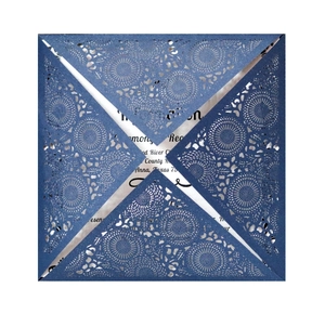 Elegant laser-cut navy blue wedding invitation cover with intricate floral patterns