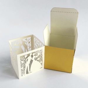 Detailed laser-cut wedding candy box with heart pattern and bride groom silhouette