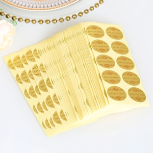 Elegant gold round 'Invitation' seal stickers with floral accents on white background