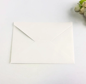 Classic white textured wedding envelope with western triangle flap and floral accent