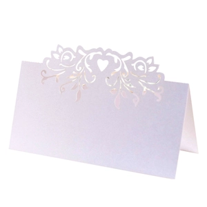 Laser cut pearl white wedding place cards with heart pattern and elegant filigree design