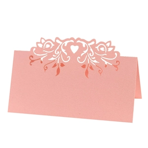 Pink laser-cut heart wedding place cards with elegant pearl paper for table setting