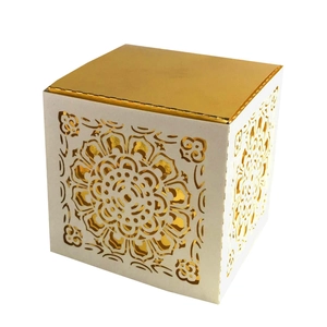 White laser-cut mandala gift box with elegant gold metallic lining and square design