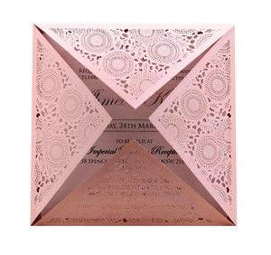 Elegant rose gold laser-cut wedding invitation with intricate floral mandala design