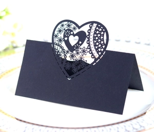 Elegant black laser cut heart wedding place cards with lace floral details for table decor