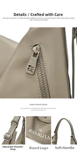 Detail of adjustable silver hardware and branded zipper on the khaki nylon tote bag