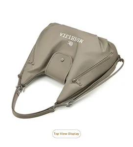 Top view of a grey nylon tote bag featuring multiple zipper pockets and a magnetic front flap