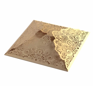 Laser cut gold pearl paper wedding invitation cover with intricate floral mandala design
