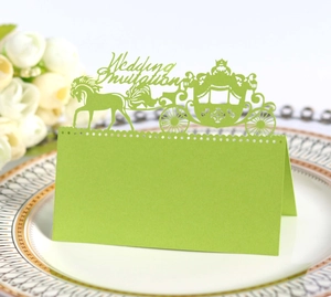 Detailed laser-cut wedding card featuring a royal carriage and horse on a ceramic plate