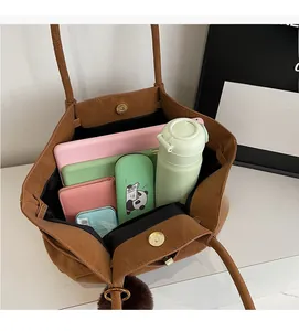 Spacious brown faux suede tote interior showing large capacity for essentials and gadgets