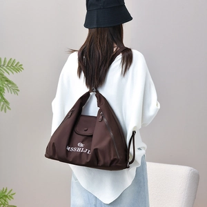 Detailed back view of a minimalist large capacity dark brown tote backpack for daily commute