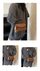 Detail of a brown leather crossbody bag featuring suede patchwork and beaded charms
