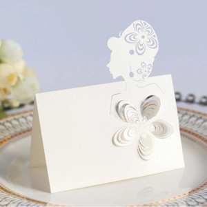 3D laser cut floral place cards in pearlescent white paper for wedding table decor