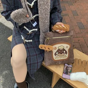 Detail of corduroy backpack with bread patch embroidery and cute plush charms