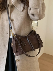 Retro dark brown suede shoulder bag with contrast stitching and side cargo pockets